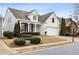 Two story home with light-colored siding and landscaping at 1440 Vinery Ave, Cumming, GA 30041