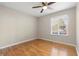 Bright bedroom featuring hardwood floors and a large window at 3335 Pinta Way, Douglasville, GA 30135