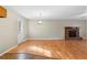 Dining room adjacent to kitchen with hardwood floors and fireplace at 3335 Pinta Way, Douglasville, GA 30135