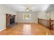 Living room featuring hardwood floors, a brick fireplace and loft view at 3335 Pinta Way, Douglasville, GA 30135