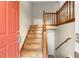 Wooden staircase leading to the upper level of the home at 3335 Pinta Way, Douglasville, GA 30135