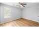 Well-lit bedroom with wood-look floors and ceiling fan at 6300 Creekford Dr, Lithonia, GA 30058