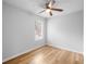 Light-filled bedroom with ceiling fan and wood-look floors at 6300 Creekford Dr, Lithonia, GA 30058