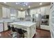 Modern kitchen with white cabinets, stainless steel appliances, and an island at 1265 Gallatin Way, Suwanee, GA 30024