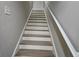 Modern staircase with wood and white risers at 1265 Gallatin Way, Suwanee, GA 30024