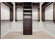 Large walk-in closet with custom shelving and drawers at 1820 Peachtree Nw St # 1909, Atlanta, GA 30309
