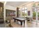 Well-equipped community room with pool table and seating area at 1820 Peachtree Nw St # 1909, Atlanta, GA 30309