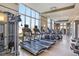 Fitness center with treadmills, other cardio equipment, and large windows at 1820 Peachtree Nw St # 1909, Atlanta, GA 30309