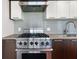 Stainless steel range and range hood in modern kitchen at 1820 Peachtree Nw St # 1909, Atlanta, GA 30309