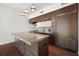 Modern kitchen with large island and stainless steel appliances at 1820 Peachtree Nw St # 1909, Atlanta, GA 30309