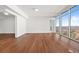 Spacious living area with hardwood floors and large windows at 1820 Peachtree Nw St # 1909, Atlanta, GA 30309