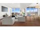Spacious living room with hardwood floors and city views at 1820 Peachtree Nw St # 1909, Atlanta, GA 30309