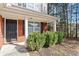 House entrance with black door and brick facade at 215 Brookwood Cv, Atlanta, GA 30349