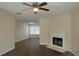 Living room with fireplace, hardwood floors, and a ceiling fan at 215 Brookwood Cv, Atlanta, GA 30349