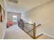 Upstairs hallway with window, seating area and railing at 340 New Alcovy Rd, Social Circle, GA 30025