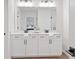 Modern bathroom with double vanity and white cabinets at 1028 Rose Dr, Marietta, GA 30060