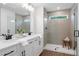 Elegant bathroom with double vanity, shower, and modern fixtures at 1028 Rose Dr, Marietta, GA 30060