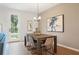 Dining area with farmhouse table and access to patio at 1028 Rose Dr, Marietta, GA 30060