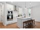 Modern kitchen with island, white cabinets, and stainless steel appliances at 1028 Rose Dr, Marietta, GA 30060