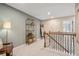 Upper hallway with a gold metal shelf and a staircase at 1028 Rose Dr, Marietta, GA 30060