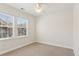 Spacious bedroom with ceiling fan and two windows at 2614 Grapevine Cir, Cumming, GA 30041