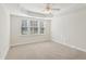 Spacious bedroom with neutral walls, carpeting and ceiling fan at 2614 Grapevine Cir, Cumming, GA 30041