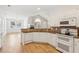 Modern kitchen with white cabinets, granite counters, and stainless steel appliances at 2614 Grapevine Cir, Cumming, GA 30041