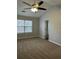 Bright bedroom with ceiling fan and carpet at 268 Springbottom Dr, Lawrenceville, GA 30046