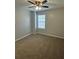 Spacious bedroom with ceiling fan and carpet at 268 Springbottom Dr, Lawrenceville, GA 30046