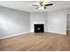 Spacious living room featuring a fireplace and light wood flooring at 268 Springbottom Dr, Lawrenceville, GA 30046