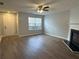 Spacious living room featuring a fireplace and wood-look floors at 268 Springbottom Dr, Lawrenceville, GA 30046