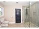 Stylish bathroom with pebble shower floor, tile walls, and a modern glass shower at 3002 Laguna Dr, Decatur, GA 30032