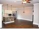 Modern kitchen with stainless steel appliances, a large island, and hardwood floors at 3002 Laguna Dr, Decatur, GA 30032