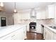 Kitchen showcases stainless steel appliances, white cabinetry, and a marble countertop on the island at 3002 Laguna Dr, Decatur, GA 30032