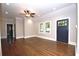 Spacious living room with dark hardwood floors, ceiling fan, and natural light at 3002 Laguna Dr, Decatur, GA 30032