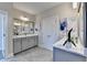 Modern bathroom with double vanity and gray tile flooring at 606 Broadview Ne Ter, Atlanta, GA 30324