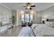 Main bedroom with hardwood floors, sitting area, and large windows at 606 Broadview Ne Ter, Atlanta, GA 30324