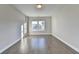 Bright bedroom with hardwood floors and large windows at 606 Broadview Ne Ter, Atlanta, GA 30324