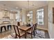 Open concept dining room with wood table and kitchen view at 606 Broadview Ne Ter, Atlanta, GA 30324