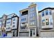 Three-story townhome with gray exterior and attached garage at 606 Broadview Ne Ter, Atlanta, GA 30324