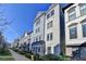 Modern townhome community with brick and gray siding, featuring a courtyard and manicured landscaping at 606 Broadview Ne Ter, Atlanta, GA 30324