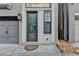 Inviting front entrance with a modern door and welcome mat at 606 Broadview Ne Ter, Atlanta, GA 30324