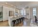 Modern kitchen with white cabinets, island with seating, and hardwood floors at 606 Broadview Ne Ter, Atlanta, GA 30324