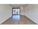 Bright living room with hardwood floors and sliding glass doors leading to a balcony at 606 Broadview Ne Ter, Atlanta, GA 30324