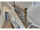 Elegant staircase with wooden steps and black metal railing at 606 Broadview Ne Ter, Atlanta, GA 30324