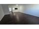 Spacious living room featuring dark brown wood-look flooring at 6628 Wellington Sq, Norcross, GA 30093