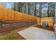 Private backyard with concrete patio and wood fence at 1032 Rose Dr, Marietta, GA 30060