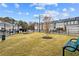 Community dog park with grassy area, benches, and waste disposal at 1032 Rose Dr, Marietta, GA 30060