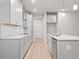 Modern kitchen with island, stainless steel appliances, and light gray cabinets at 1032 Rose Dr, Marietta, GA 30060
