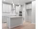 Modern kitchen with island, stainless steel appliances, and light gray cabinets at 1032 Rose Dr, Marietta, GA 30060
